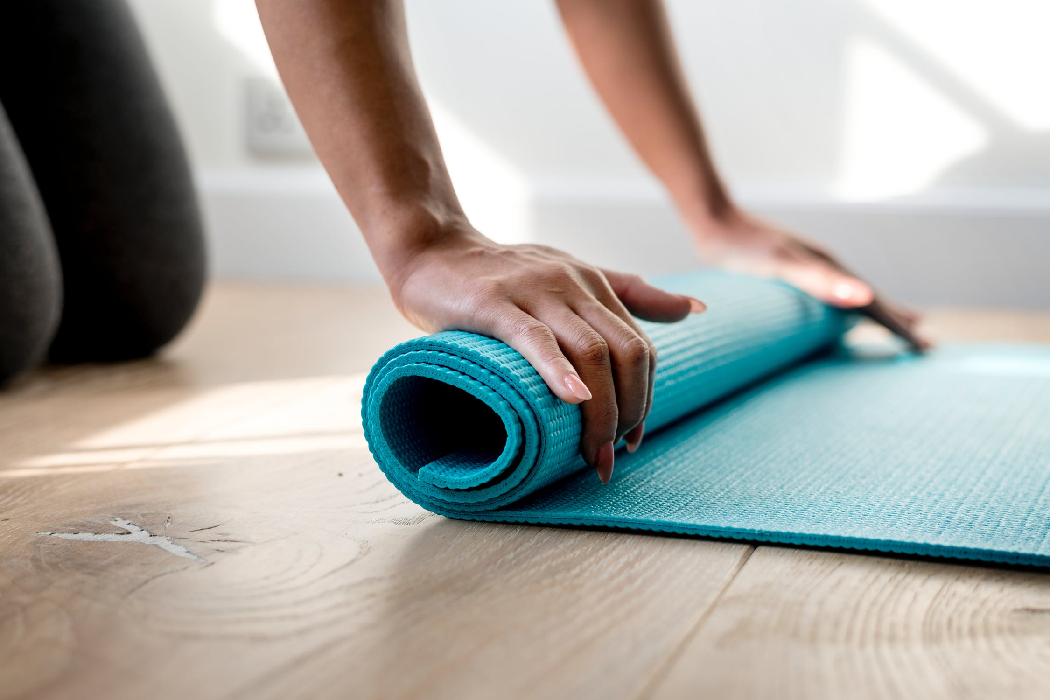 Photo of a yoga mat being rolled up