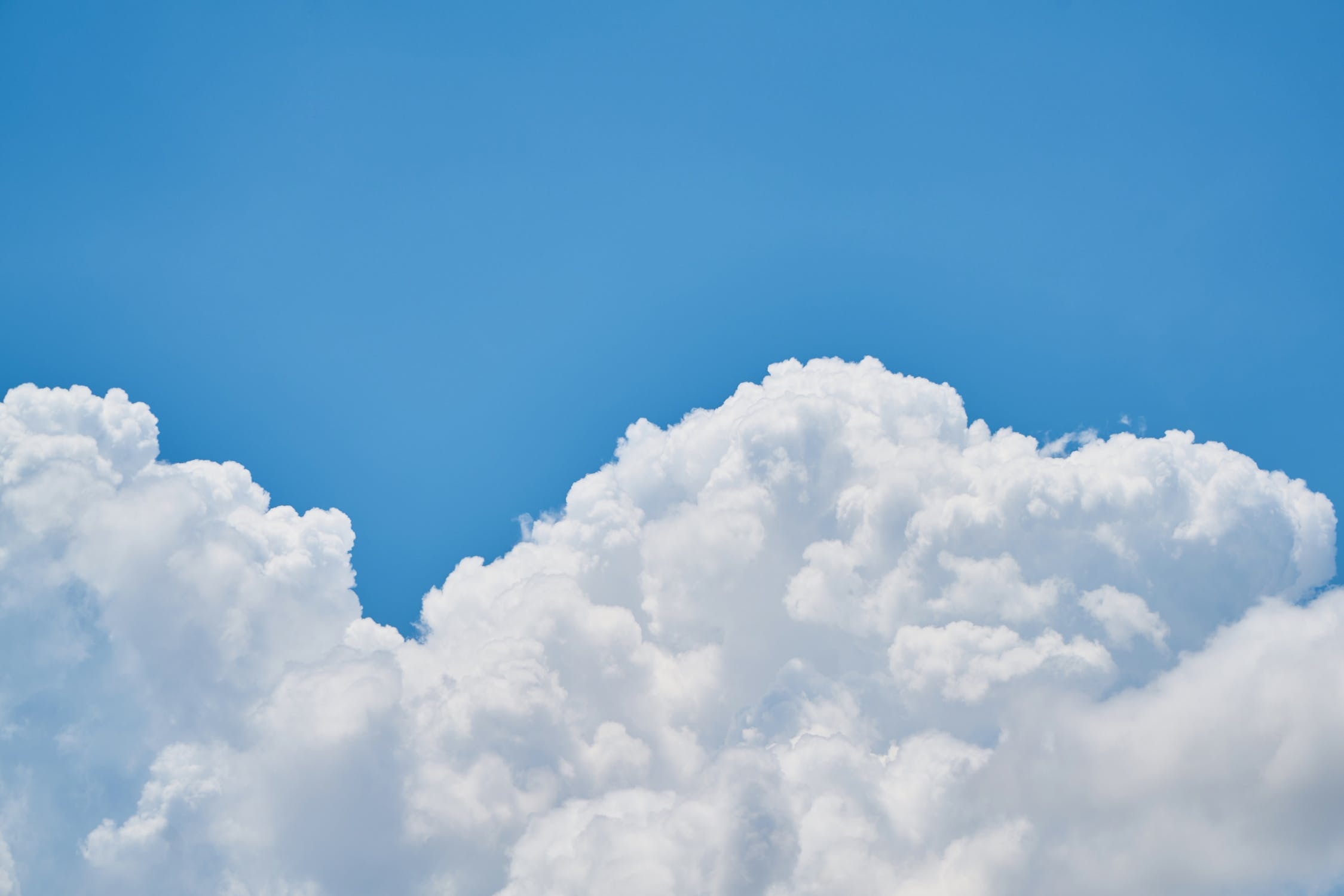 White Clouds in a blue sky image