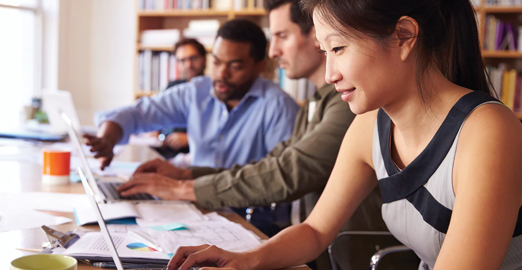 Diverse staff collaborating at work