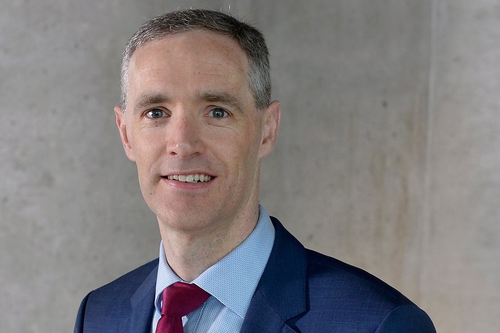 Headshot of Gareth Burns in a suit and tie