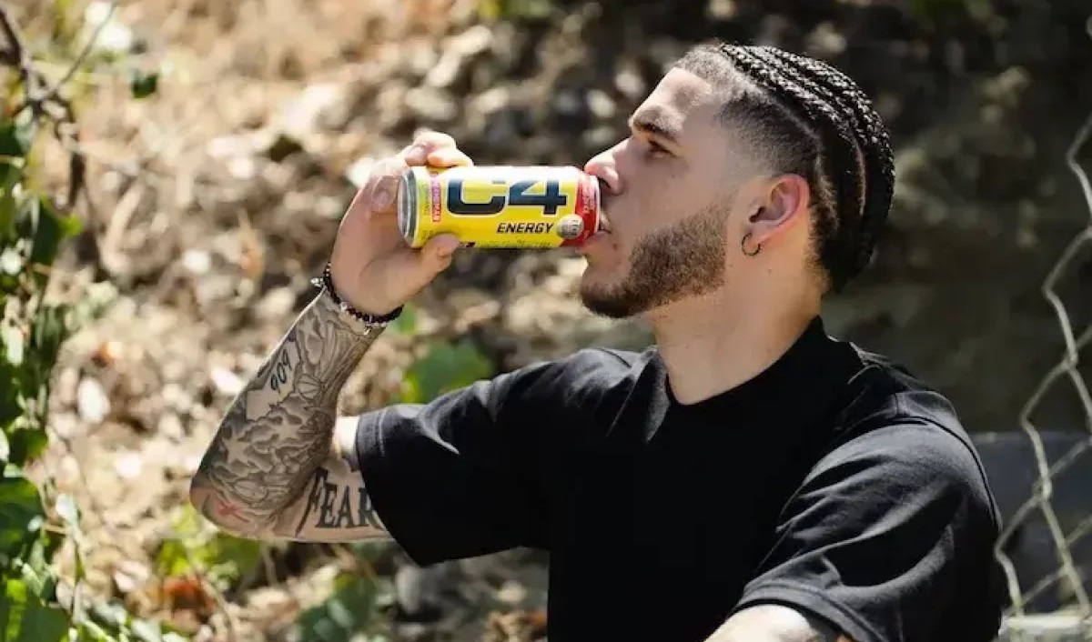 Man drinking can of C4 energy drink