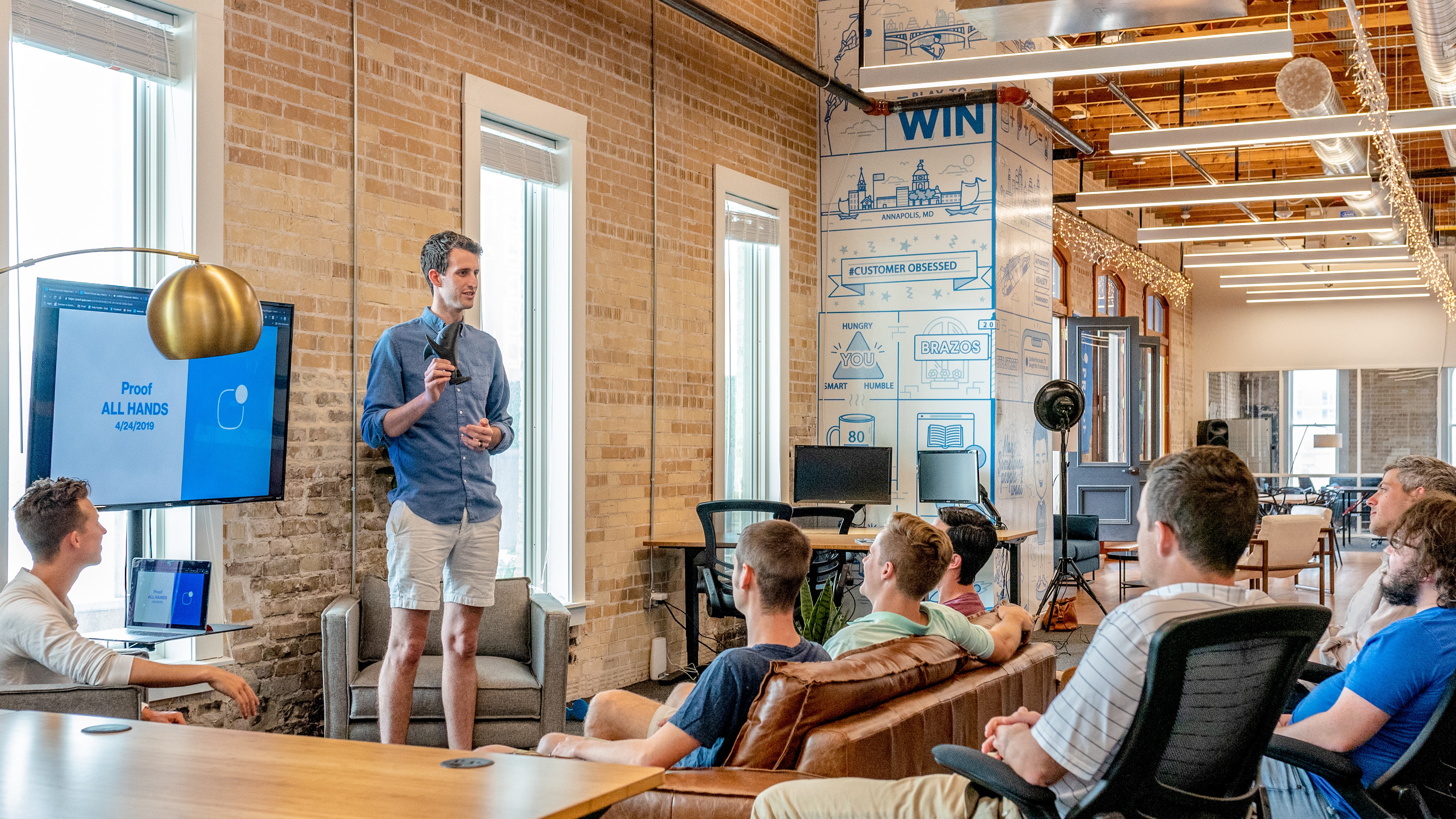 Man giving a pitch in an office